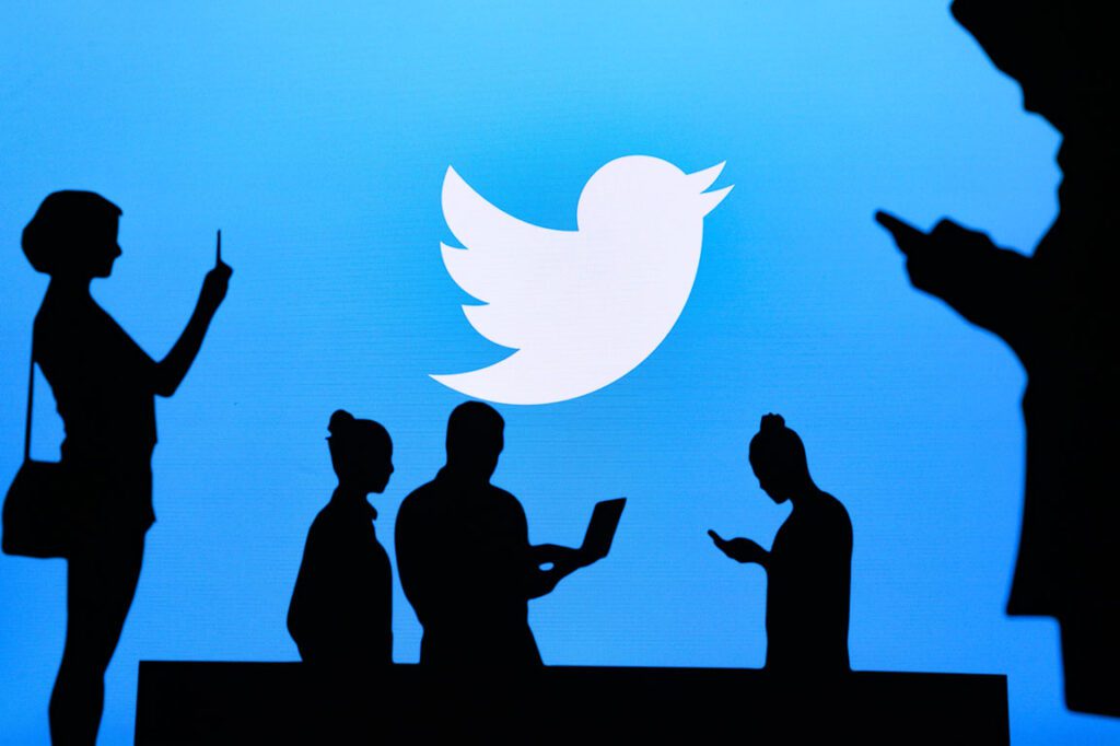 silhouette of people attending a Twitter conference
